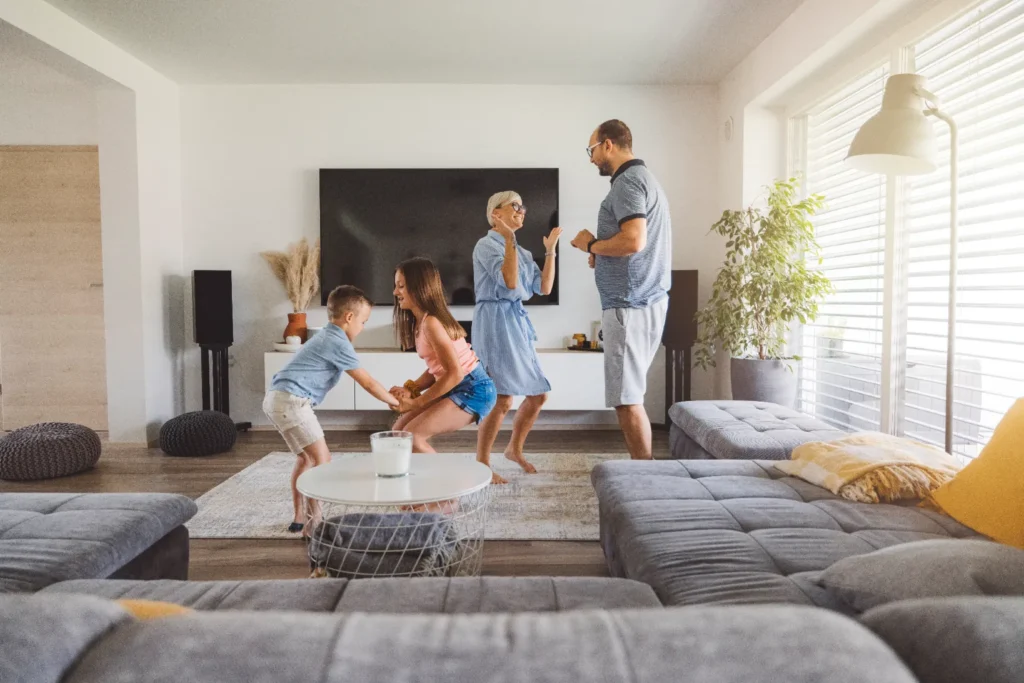 A lively family scene in a living room.